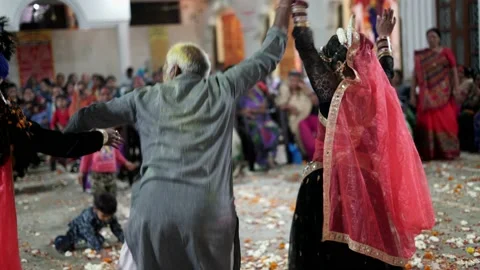 An Old Man Dancing with Radha Krishna during Maharaas function Stock Footage 130972280