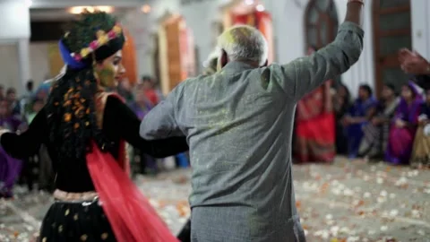 An Old Man Dancing with Radha Krishna during Maharaas function Stock Footage 130999532