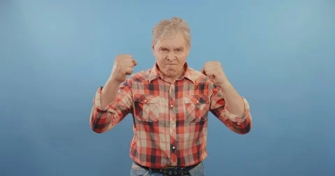 Old man demonstrating strength Stock Footage 114127985