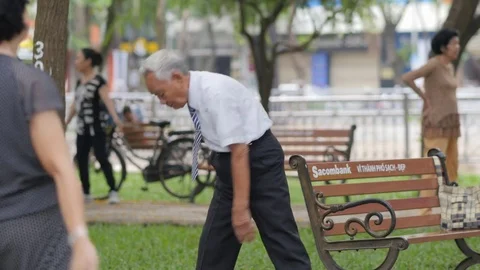 Old man doing excercise in park,Saigon,Vietnam Stock Footage 77730350