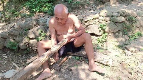 Old Man Doing Traditional Work with Simple Tools Stock Footage 316970394