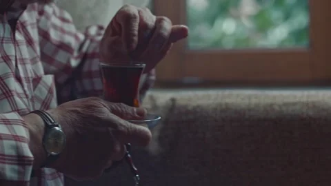 An old man is drinking tea in their home. Stock Footage 170036333