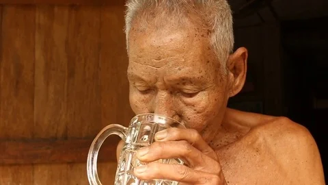 Old man drinking water Stock-Footage 73712652