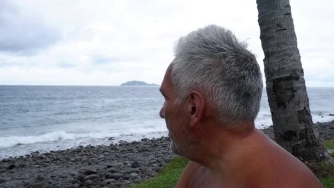 Old man drinks on the ocean. Video stock 122248393