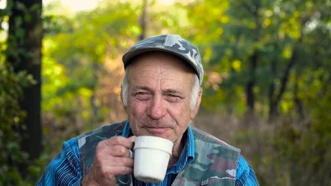 Old man drinks tea Stock Footage 124416045