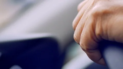 Old man driving car in day time, hand on steering wheel 库存影片 80903986