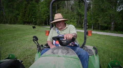 Old Man Driving Tractor Stock Footage 39069135