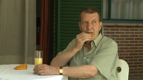 Old man eating Video stock 33820082