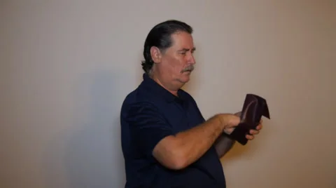 Old man with empty wallet with one cent 2 Stock Footage 52954151