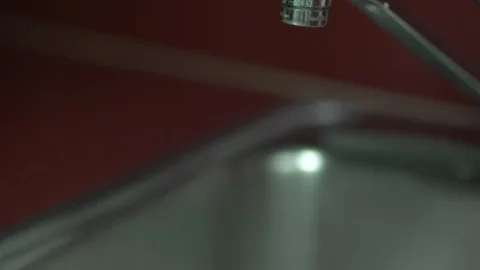 Old man getting water into a cup. Hands. Stock Footage 127955598