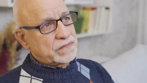 The old man with the glasses is thoughtful. Stock-Footage 219689745