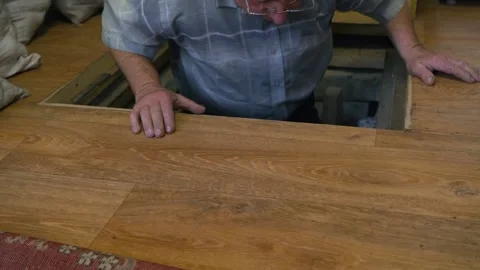 An old man goes down to the basement Stock Footage 167324765