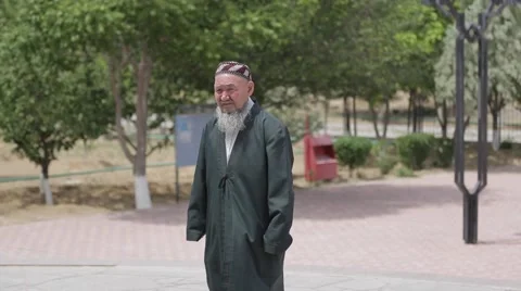 Old  man goes to the mosque to pray. Stock Footage 62063626