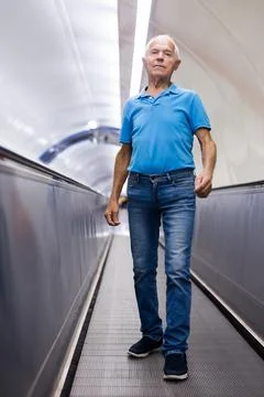 Old man going down to metro station Stock Photos