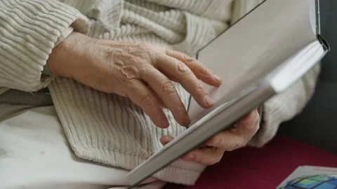 Old man hands leafing through a book, Poland Stock Footage 237454582