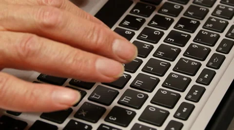 Old man hands typing on a laptop keyboard Stock Footage 60687811