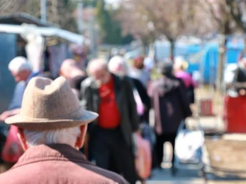 Old man with a hat walking through the park,blur Stock Photos