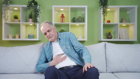 The old man is having stomach ache. Stock Footage 237794661