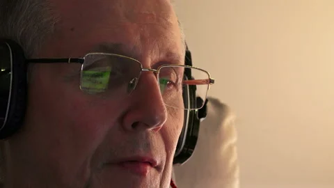 Old man with headphones Stock Footage 87574533