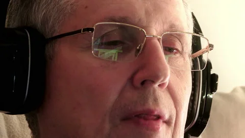 Old man with headphones Video stock 87574537
