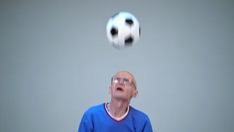 Old Man Is Hitting Ball With His Head And Juggling It Stock Footage 129074977