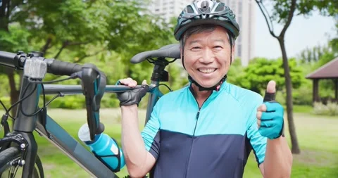 Old man holding a bicycle Stock Footage 139449641