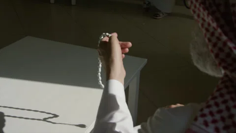 Old man holding prayer beads. Stock Footage 135674904