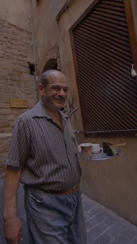 Old man holding tray walking in old neighborhoods  nostalgia Stock Footage 274487198