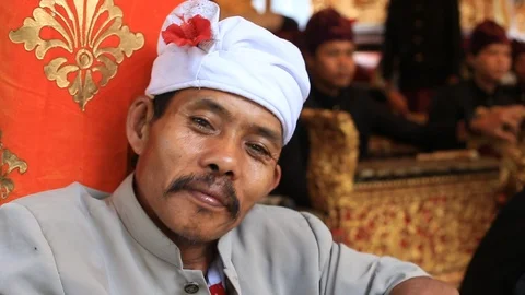 Old man at holy temple during the religious ceremony in Bali, Indonesia Stock Footage 92313756