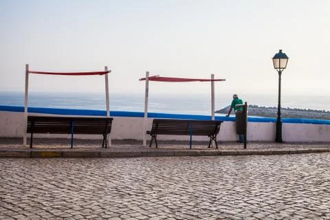 Old man looking over the ocean Stock Photos