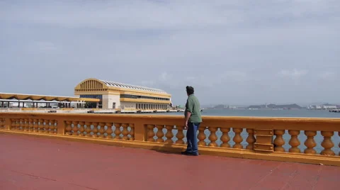 OLD MAN LOOKING AT PIER and docks in Old San Juan Stock Footage 51353034