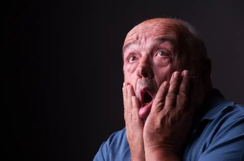 Old man looking scared or crazy Stock Photos