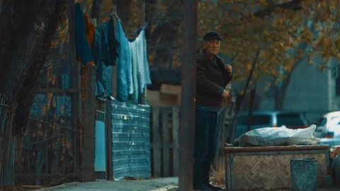 An old man is looking for something in his pockets Stock Footage 101367779