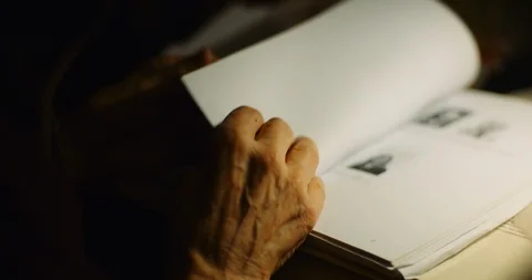 Old Man looking Through Documents at Desk at Night Video stock 126055628