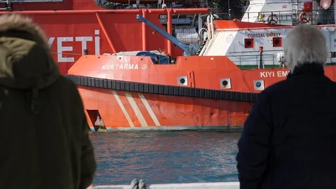 Old Man Looking at the Turkish Coast Guard Boat from Ferryboat Bosporus Istanbul Stock Footage 128969404