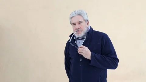 Old man looks at camera Video stock 71729941