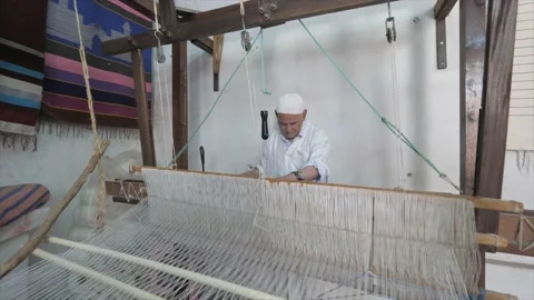 Old man making hand made carpet with traditional way, Rabat, Morocco, Stock Footage 168394265
