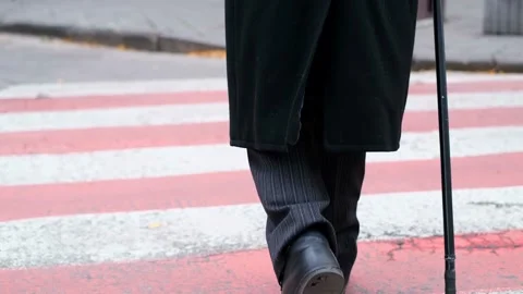 An old man in old shoes with a stick in ... | Stock Video | Pond5