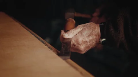 Old man opening the back of a mirror in his cellar 스톡 동영상 139756061