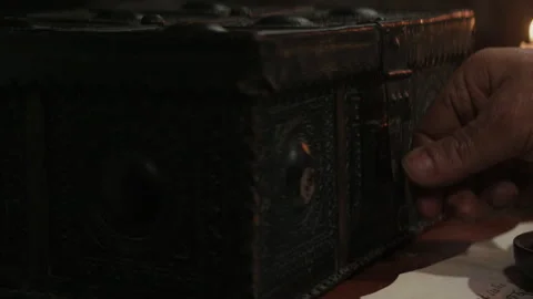 An old man opening an old box in an old ship cabin Video stock 259693431