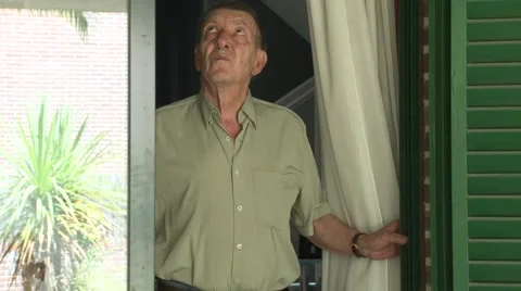 Old man opening window Video stock 54685411