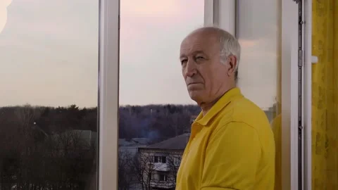 Old man opens the window and looks at the camera Stock Footage 155972644