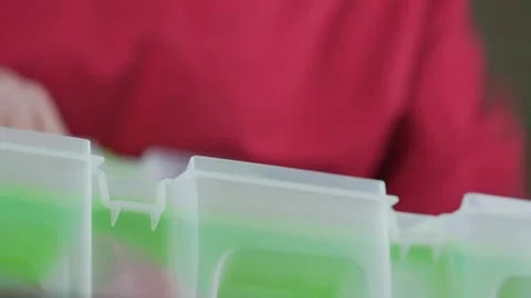 Old man packing equipment in tool box and closed container with clips. Stock Footage 150297237