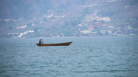 Old Man Paddle Boating in Fewa Lake Stock Footage 238020355