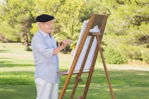 Old man painting in the park Stock Photos