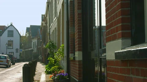 Old man passing by with its bicycle on Nieuwe Raamstraat Haarlem Netherlands Stock Footage 50321985
