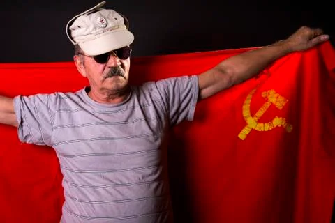 Old man patriot with flag of the USSR Stock Photos