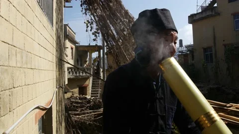 Old man with pipe-china-hani rice terraces-hani tribe Stock Footage 130436285