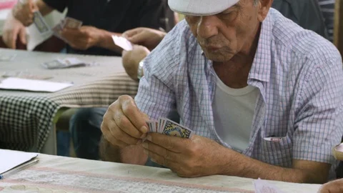 Old man play cards Stock Footage 114858745