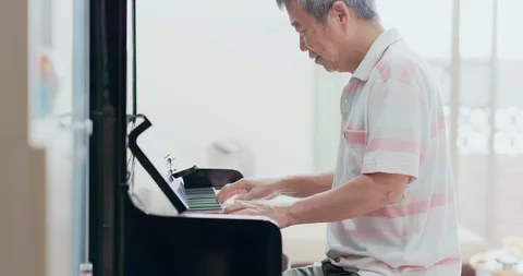 Old man play the piano Stock Footage 113301657